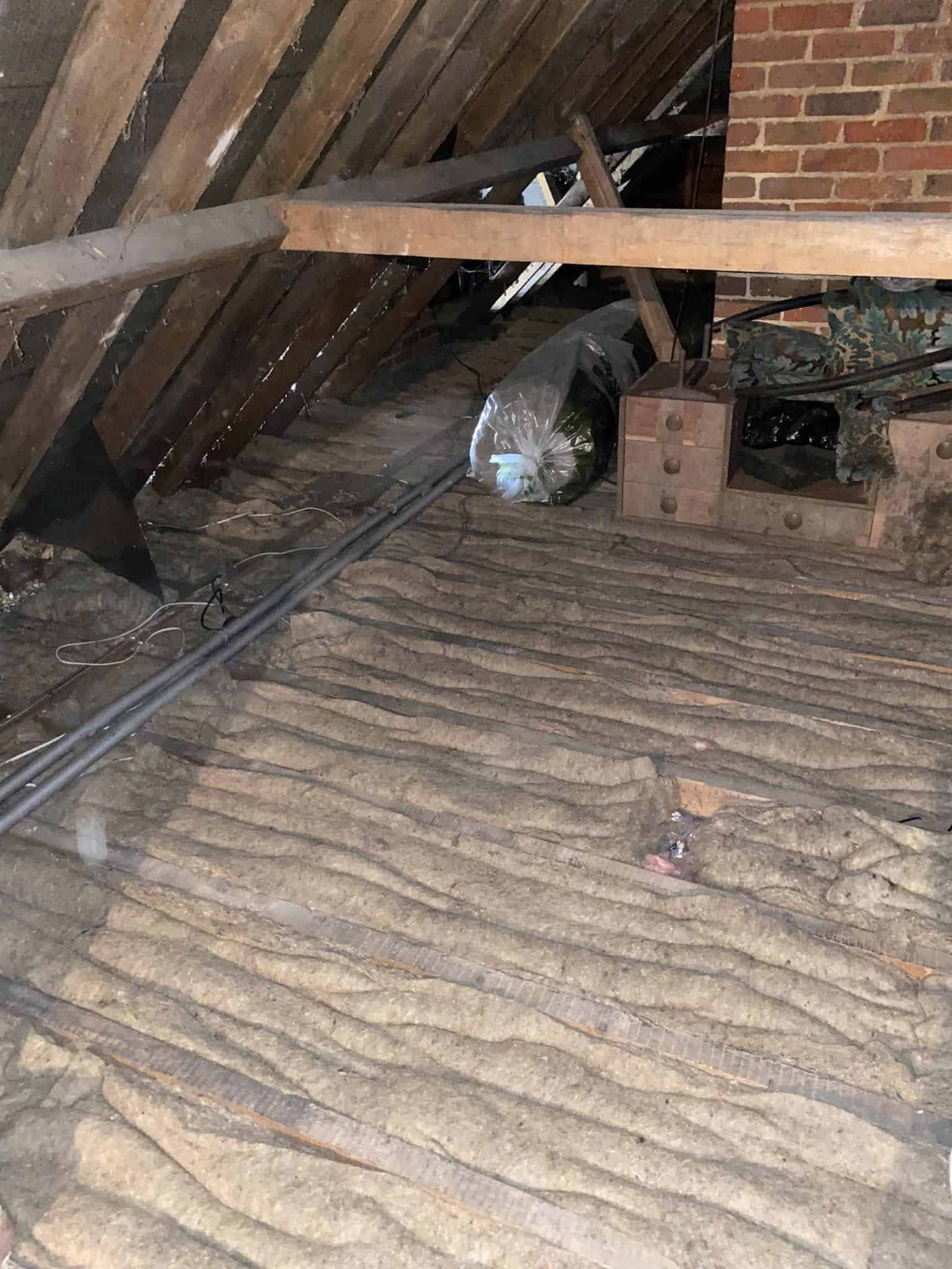 should old loft insulation be removed or topped up?